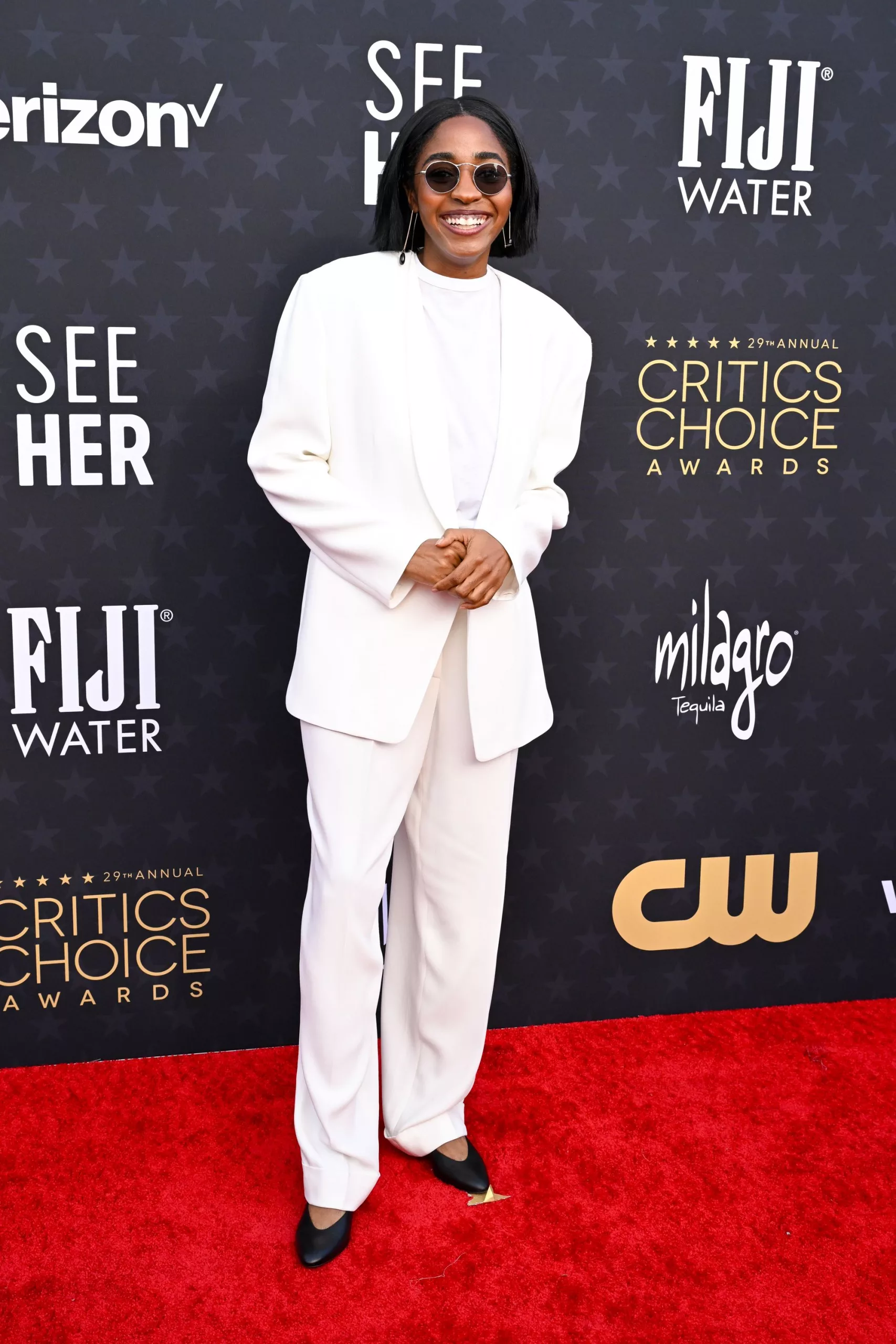 “The Bear” actress Ayo Edebiri arrived in an all-white suit, by the Olsen twins' label The Row, and Oliver Peoples sunglasses.