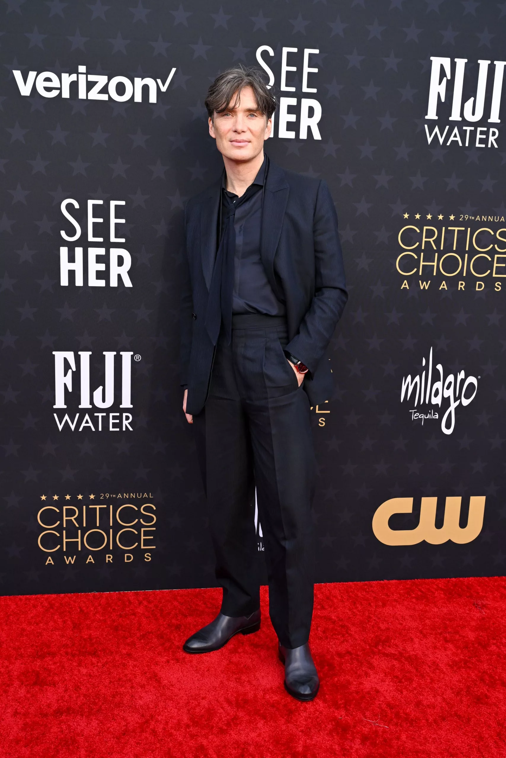 Cillian Murphy, nominated for “Oppenheimer,” went for a navy three-piece suit and loosely fitted tie.