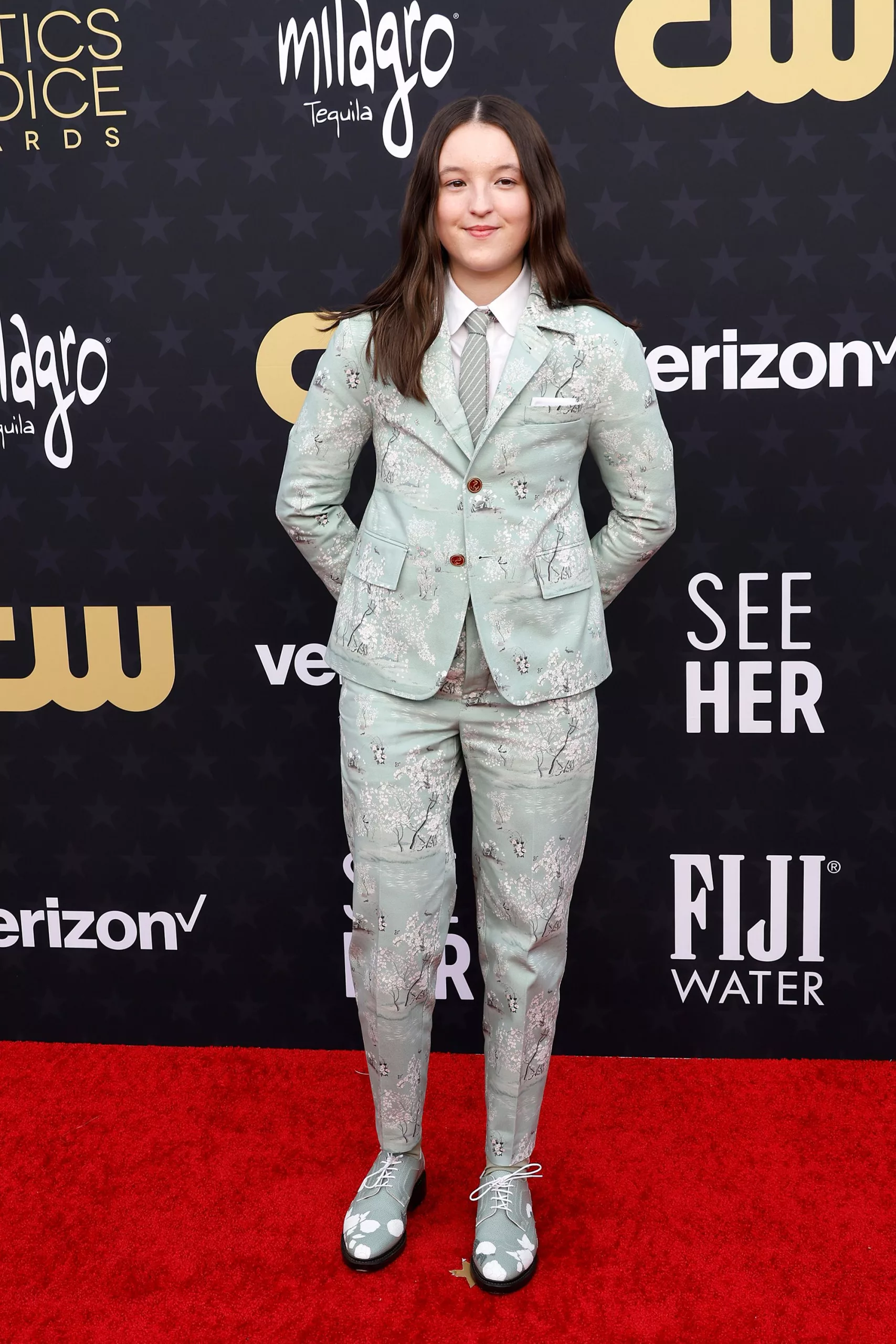 Nominated for her turn in “The Last of Us,” actress Bella Ramsey arrived in a mint-green Thom Browne suit with white blossom detailing and matching shoes.